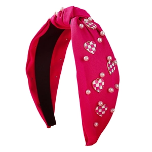 Hot pink wide knotted headband with faux pearls and checkered heart decorations