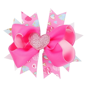 Layered grosgrain bow hair clip with colorful heart patterns for kids' Valentine accessories