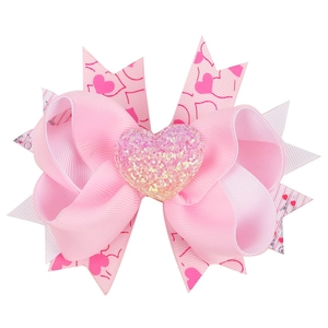Pink multi-layer grosgrain ribbon hair bow with red hearts and glitter heart centerpiece