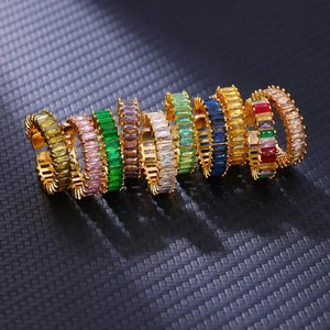 Set of 10 gold-plated adjustable rings with multi-color baguette-cut zircons on black background
