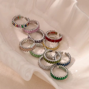 Macro detail of silver adjustable rings featuring colorful rectangular zircon stones