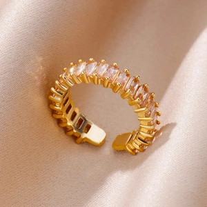 Detailed close-up of a gold adjustable ring with micro-pave rectangular cubic zirconia