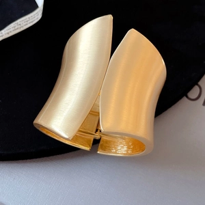 Asymmetric matte gold wide open bangle with textured brushed finish and hinge