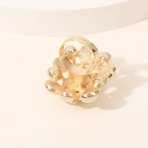 Elegant gold cat eye ring featuring a white opal stone and irregular diamond encrusted frame