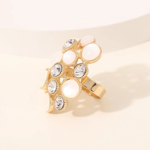 Elegant gold cat eye stone ring with sparkling diamond accents and irregular open design