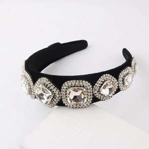Baroque black velvet headband with large crystal gemstones on white display block