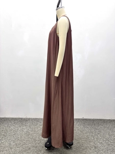 Side view of dark coffee sleeveless maxi dress with textured fabric on a mannequin