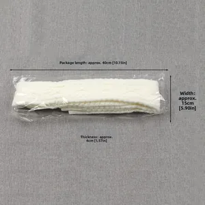 Detailed knit texture and dimensions of white cable knit leg warmers in packaging