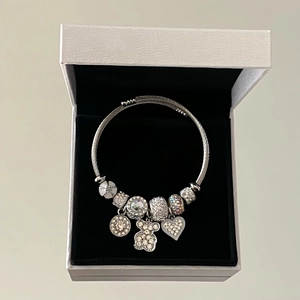 Silver beaded bracelet with crystal bear and heart pendants in a gift box