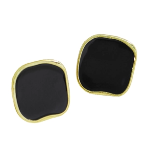 Detail of square black enamel stud earrings with irregular gold vintage metallic frames
