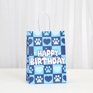 Blue checkerboard gift bag with puppy paw prints and white Happy Birthday lettering