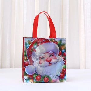 Glossy Christmas non-woven tote bag with Santa Claus print and sturdy red handles