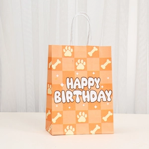 Orange checkered Happy Birthday gift bag with cute dog paw prints and bone patterns
