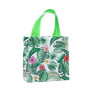 Tropical rainforest print non-woven tote bag with green handles and hibiscus pattern