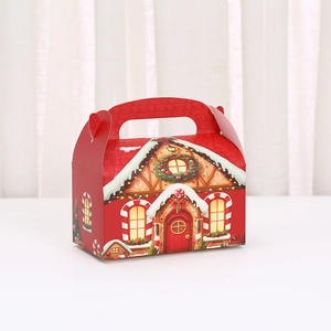 Red Christmas gingerbread house gift box with festive handle for candy and holiday cookies