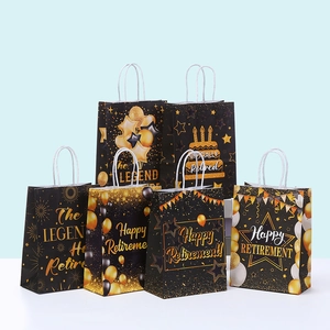Detail of 6 retirement paper gift bags with gold foil patterns and white rope handles