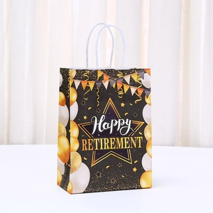 Detail of Happy Retirement gift bag featuring gold foil printing and balloon patterns