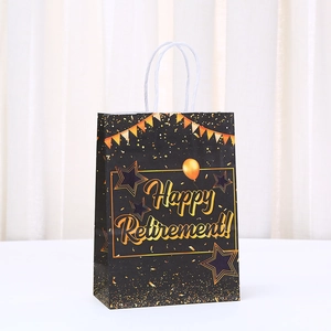 Black Happy Retirement gift bag with gold foil lettering and white rope handles