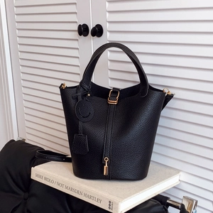 Chic black litchi grain bucket bag with gold hardware and top handles for women
