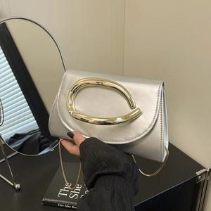 Chic silver metallic clutch bag with gold horseshoe handle and chain strap for parties