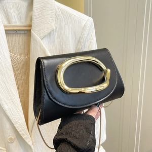 Elegant black leather clutch with gold oval buckle and chain strap for parties