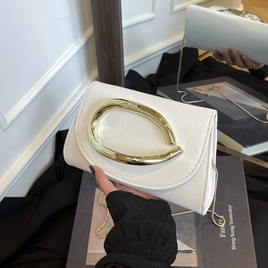Elegant white rectangle clutch with oversized gold U-handle and fine snake chain strap