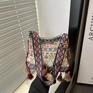 Bohemian ethnic crossbody bag with embroidery, wide strap and fringe tassels in 2025 style