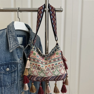Ethnic bohemian woven tote bag with colorful jacquard patterns and silk tassels for women