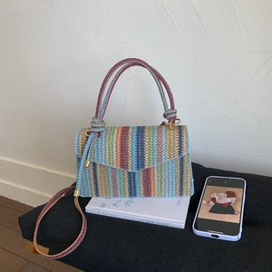Rainbow striped woven handbag with round handles and crossbody strap for summer fashion