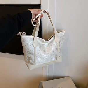 Off-white tote bag with gray butterfly prints and silver sequins for daily commute