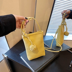 Lemon yellow litchi texture mini crossbody bag with chic braided knot decorative detail