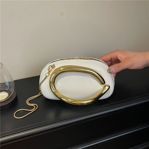 Elegant white semi-circle handbag with large gold metal handle and chain strap