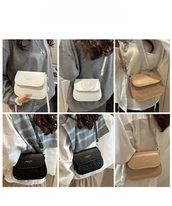 Three-color shoulder bag display with quilted flap and adjustable leather straps