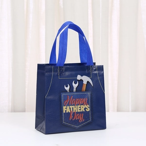 Blue non-woven gift bag with Happy Father's Day tool design and sturdy handles