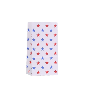 White paper gift bags with red and blue star prints for holiday candy packaging