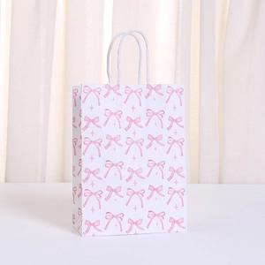 Bolsa de regalo de papel kraft blanco con lazos rosas y asas de cuerda resistentes