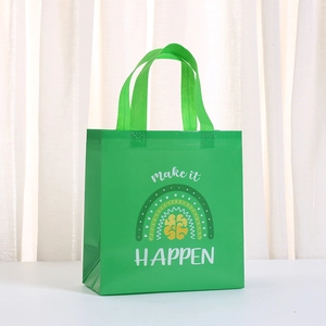 Close-up of green non-woven shopping bag featuring a rainbow motif and make it HAPPEN text
