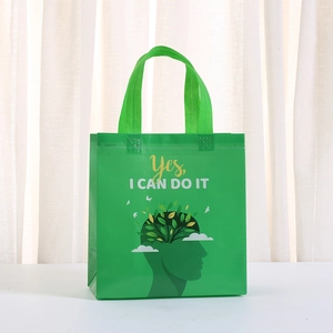 Detail of green non-woven shopping bag featuring creative Yes I Can Do It typography