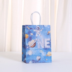Detail of blue astronaut space gift bag with ONE text and white paper handles