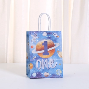 Close-up of galaxy theme kraft paper gift bag with astronaut and number one design