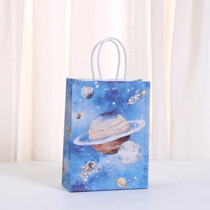 Space-themed kraft paper gift bag with astronaut and planet print for party favors