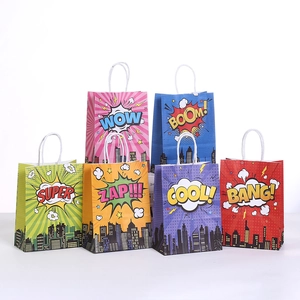 Close-up of Pop Art paper gift bags with comic burst designs and white cord handles