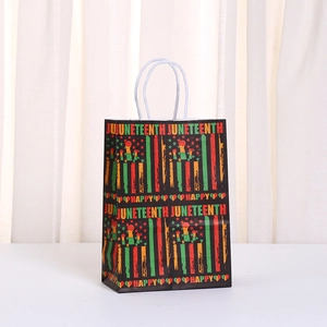 Juneteenth holiday gift bag with Pan-African stripes and star on black kraft paper