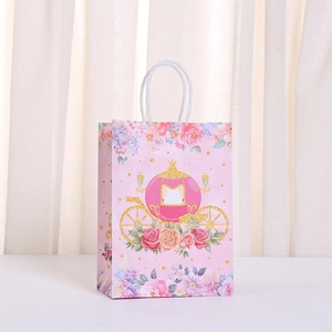 Detail of pink princess gift bag with glittery pumpkin carriage and floral patterns