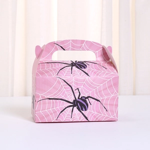 Pink Halloween gift bag with white spider web print and purple spider decorations