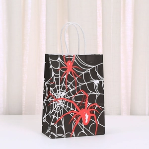 Detail of Halloween paper gift bag with spider web print and red spider pattern