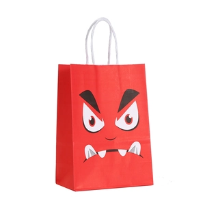 Red Halloween paper gift bag featuring monster print and white woven handles