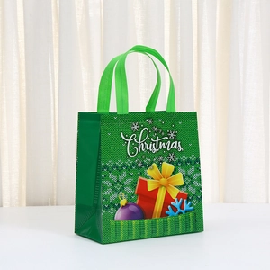 Green non-woven Christmas gift bag with Merry Christmas print and festive ornaments