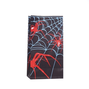 Halloween gift bag with spider web pattern and red spiders on black kraft paper