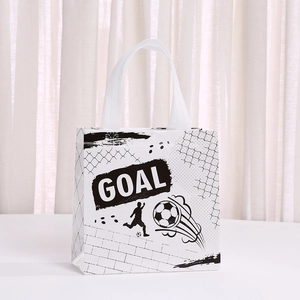 Detail of a white non-woven football gift bag featuring black GOAL text and athlete silhouettes